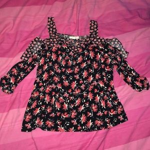A floral black off the shoulder shirt